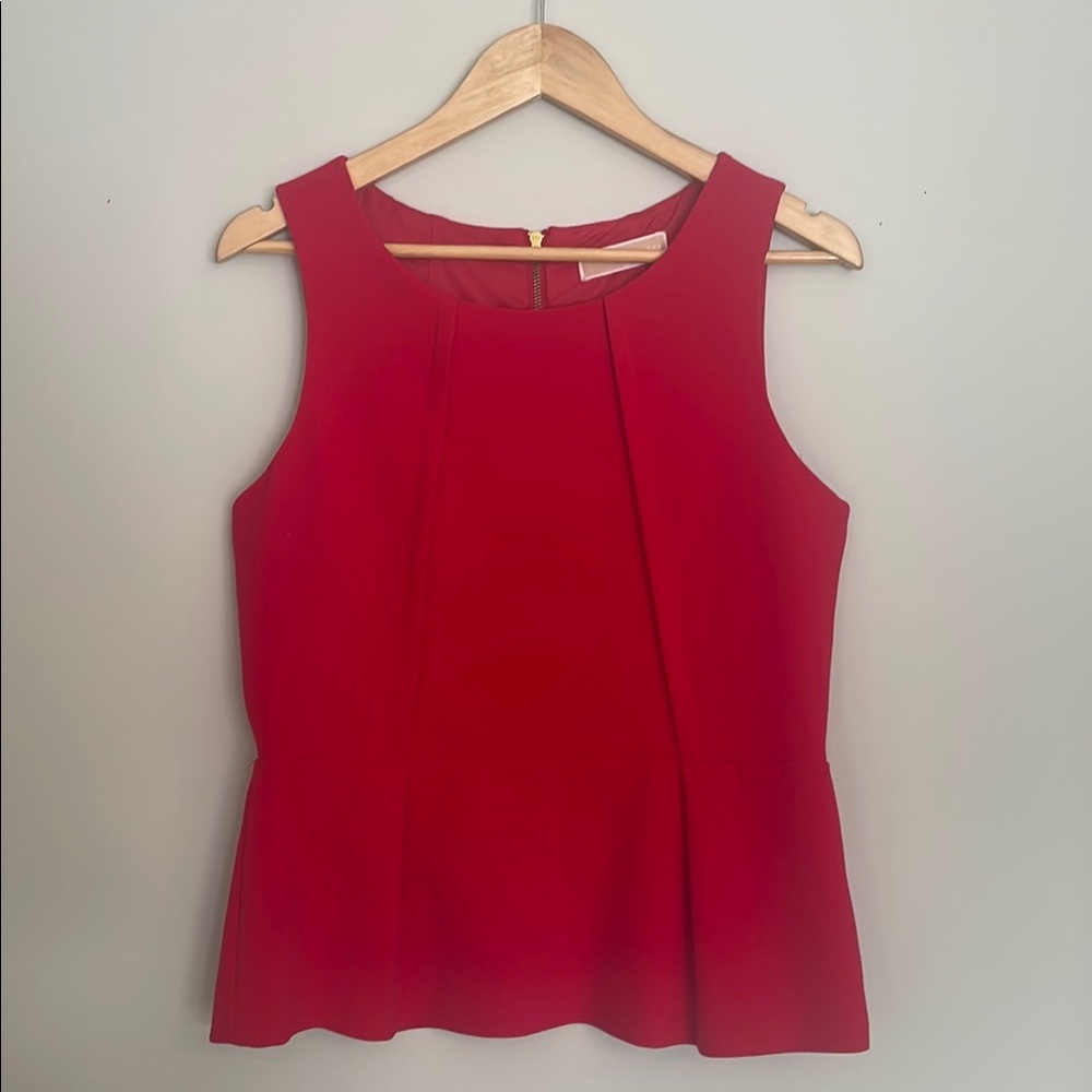 Christmas Season Ready!Michael Kors elegant sleeveless peplum top.